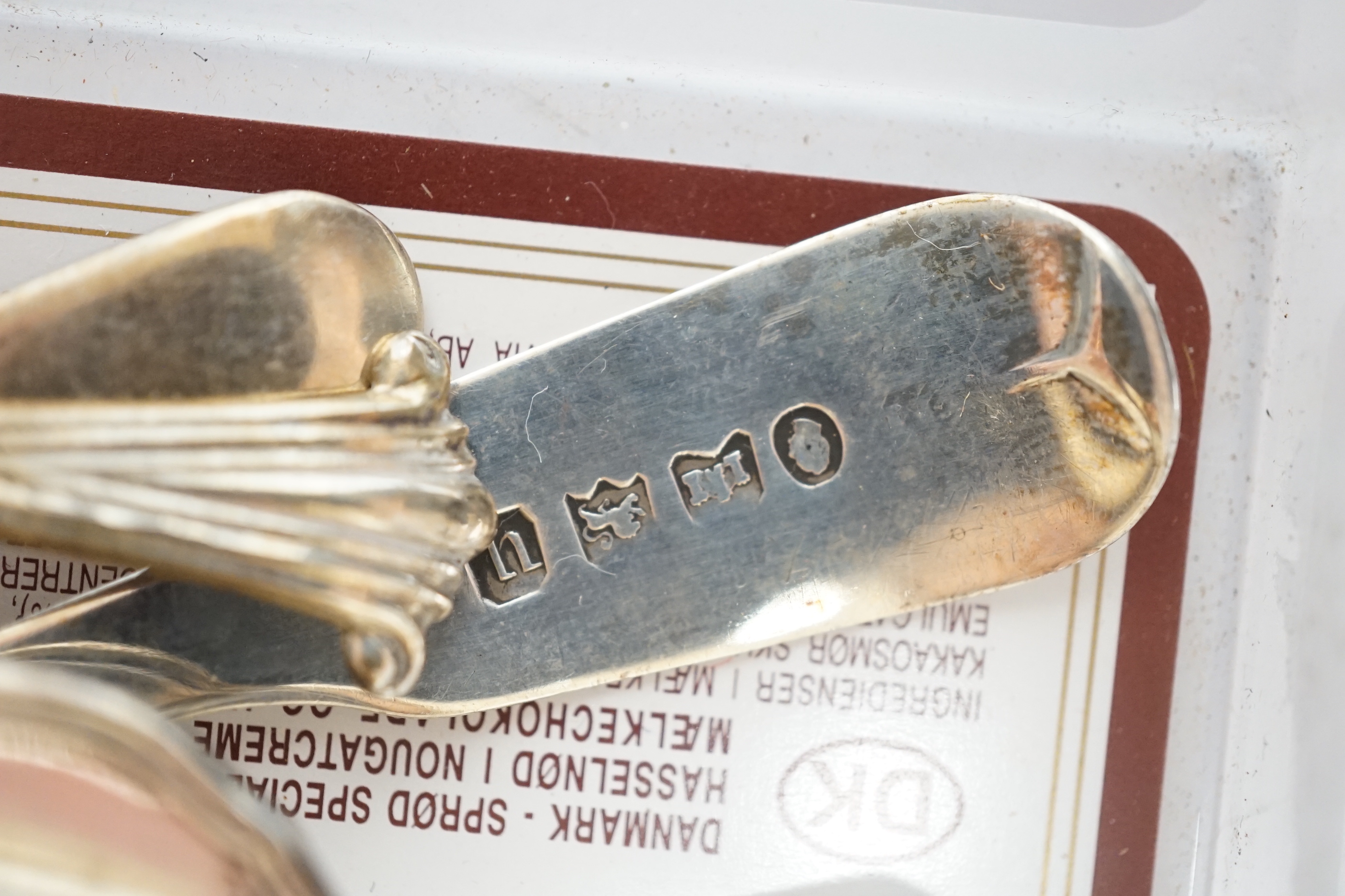 A small quantity of silver condiments and teaspoons, three silver thimbles and a sterling thimble.